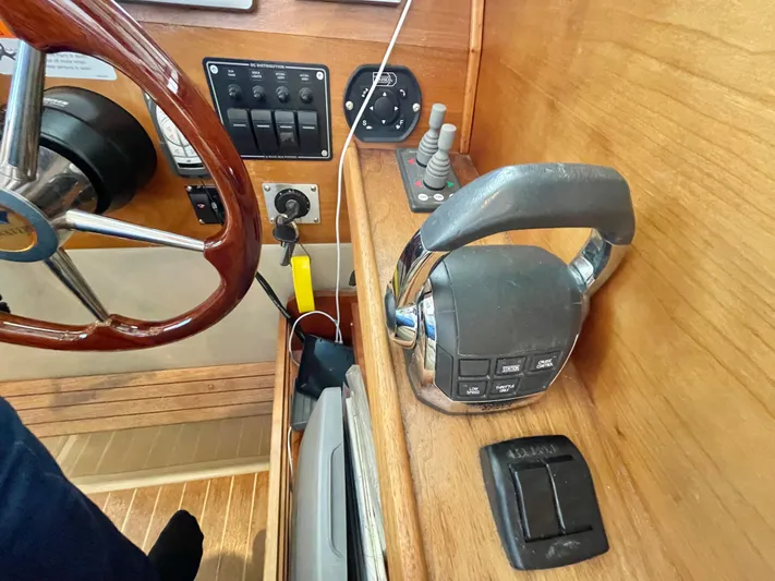 Denial Yacht Photos Pics Control panel of a 2012 Cutwater C-28 boat with steering wheel and throttle.