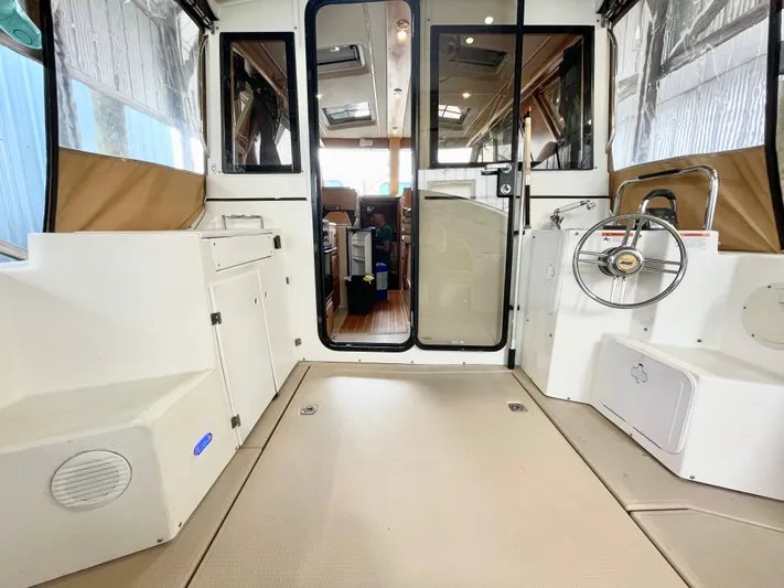 Denial Yacht Photos Pics Interior view of a 2012 Cutwater C-28 boat, featuring spacious seating and modern design.