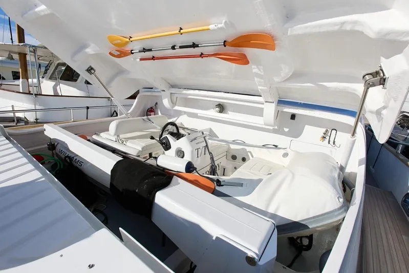 Pobedy I Yacht Photos Pics 2004 Maiora 26.5 yacht with open storage compartment and orange paddles.
