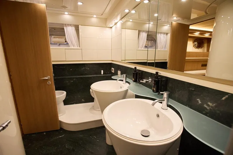 Pobedy I Yacht Photos Pics Luxurious bathroom in 2004 Maiora 26.5 yacht with dual sinks and elegant design.