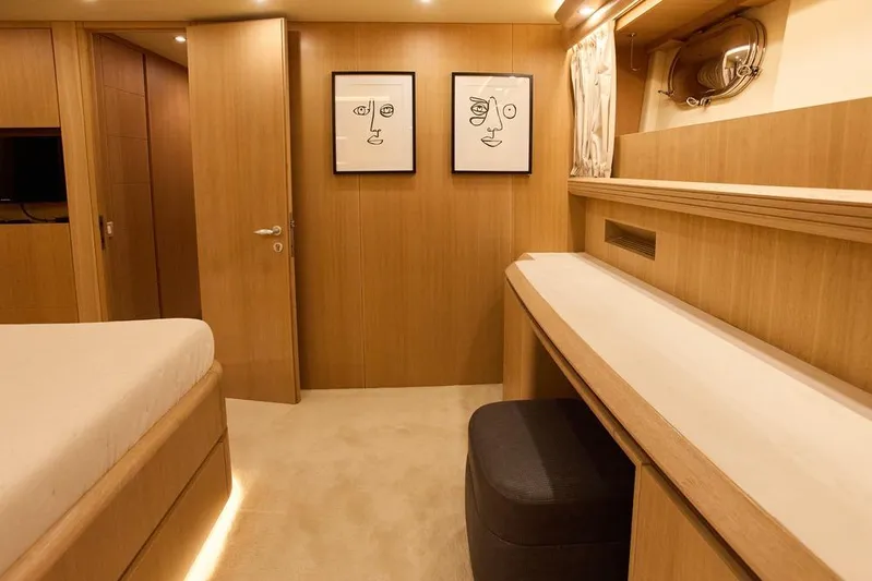 Pobedy I Yacht Photos Pics Luxurious Maiora 26.5 yacht interior, featuring elegant wood paneling and modern artwork, 2004 model.