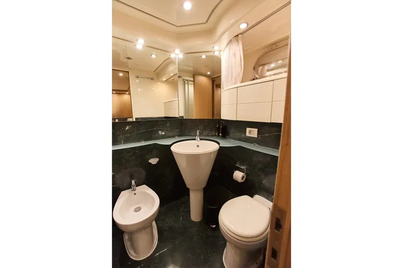 Pobedy I Yacht Photos Pics Luxurious bathroom on 2004 Maiora 26.5 yacht with modern fixtures and elegant design.