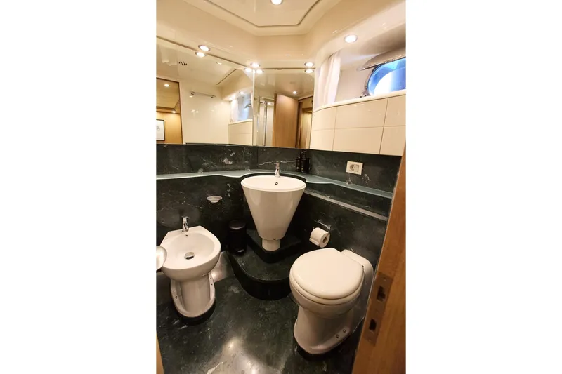 Pobedy I Yacht Photos Pics Luxurious bathroom in 2004 Maiora 26.5 yacht with modern fixtures and elegant design.