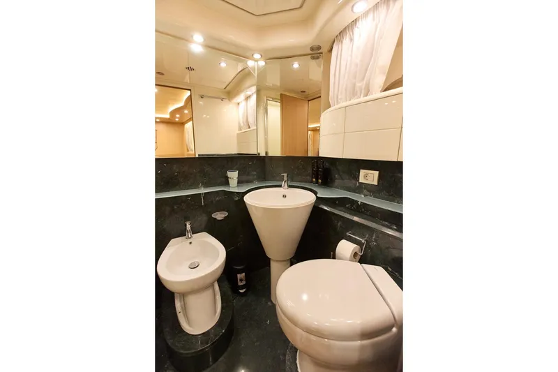 Pobedy I Yacht Photos Pics Luxurious bathroom in 2004 Maiora 26.5 yacht with modern fixtures and elegant design.
