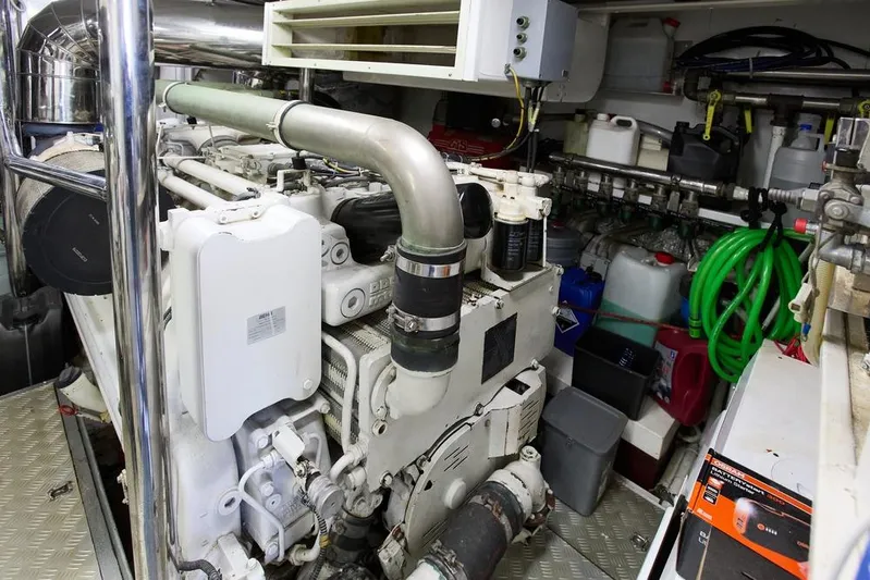 Pobedy I Yacht Photos Pics Engine room of 2004 Maiora 26.5 yacht with machinery and storage containers.