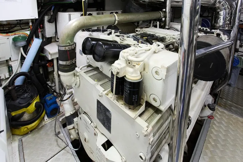 Pobedy I Yacht Photos Pics Engine room of a 2004 Maiora 26.5 yacht, showcasing mechanical components and equipment.