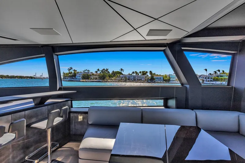  Yacht Photos Pics Interior view of 2025 Pershing GTX 80 yacht with ocean and island scenery.