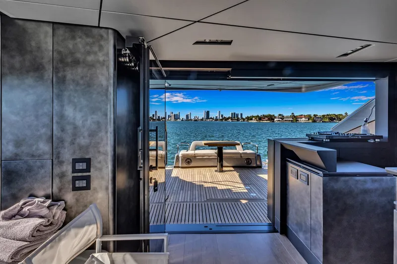  Yacht Photos Pics Luxury interior view of 2025 Pershing GTX 80 yacht with ocean and city skyline.