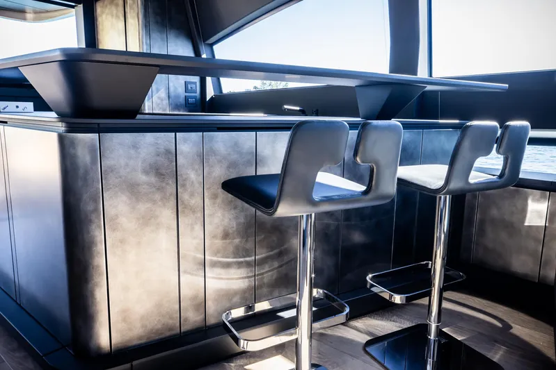  Yacht Photos Pics Luxury interior of 2025 Pershing GTX 80 yacht with modern bar stools.
