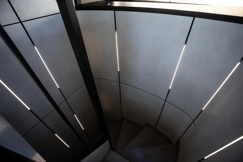  Yacht Photos Pics Spiral staircase with modern lighting inside 2025 Pershing GTX 80 yacht.