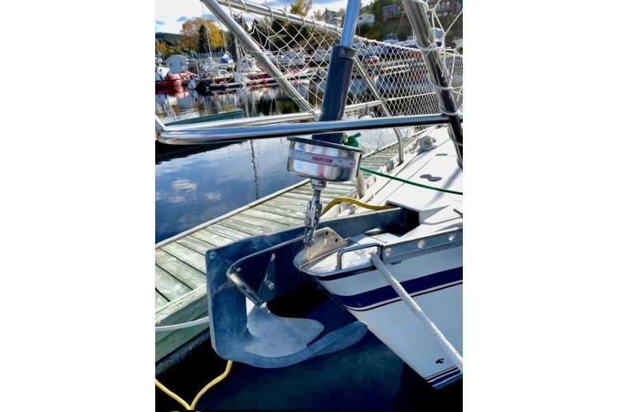 Sailboat anchor detail on 1990 CS 34 model, docked at marina.