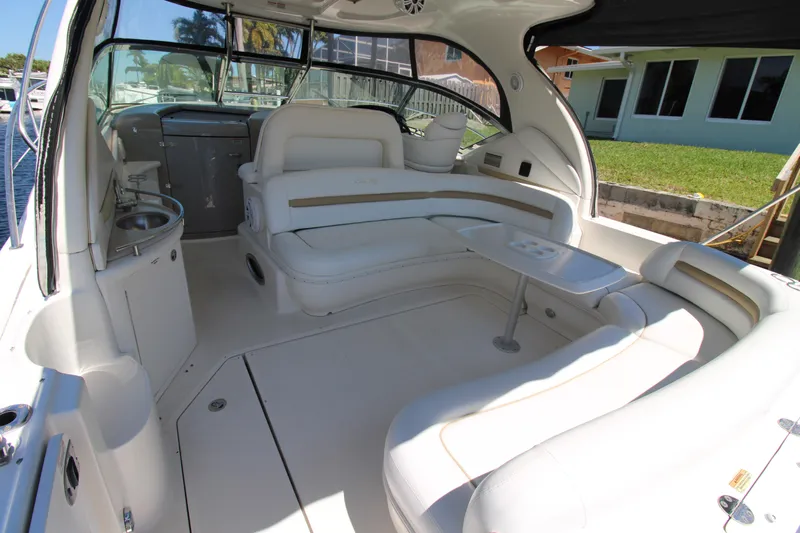 Rowdy Rio Yacht Photos Pics 2008 Sea Ray 44 Sundancer yacht interior with white seating and table.