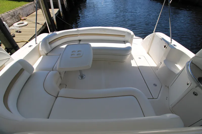 Rowdy Rio Yacht Photos Pics 2008 Sea Ray 44 Sundancer boat with spacious white seating and table on deck.