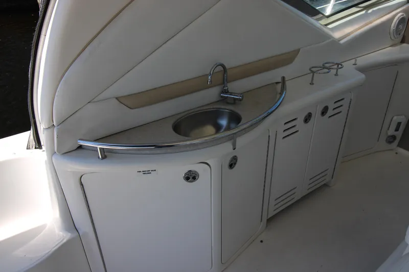 Rowdy Rio Yacht Photos Pics 2008 Sea Ray 44 Sundancer yacht kitchenette with sink and storage cabinets.