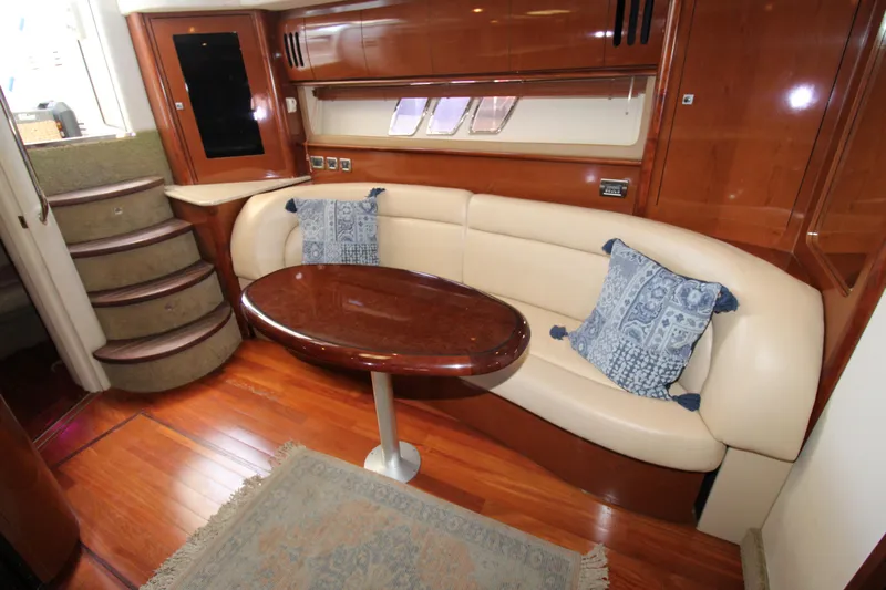 Rowdy Rio Yacht Photos Pics Luxurious 2008 Sea Ray 44 Sundancer interior with elegant seating and wooden table.
