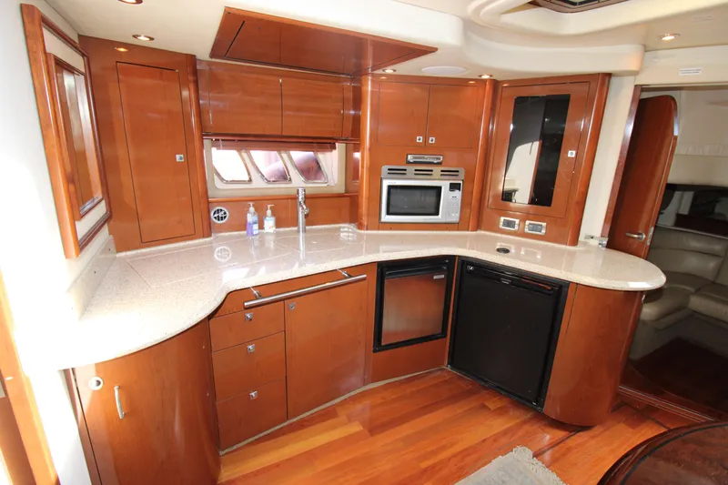 Rowdy Rio Yacht Photos Pics Luxurious kitchen interior of 2008 Sea Ray 44 Sundancer yacht with modern appliances.