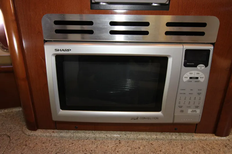 Rowdy Rio Yacht Photos Pics Built-in Sharp microwave in 2008 Sea Ray 44 Sundancer yacht kitchen.