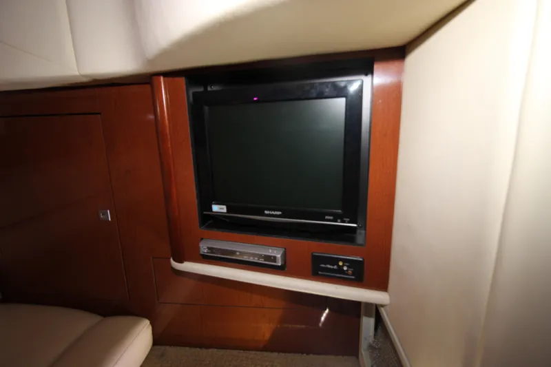 Rowdy Rio Yacht Photos Pics 2008 Sea Ray 44 Sundancer interior with built-in TV and entertainment system.