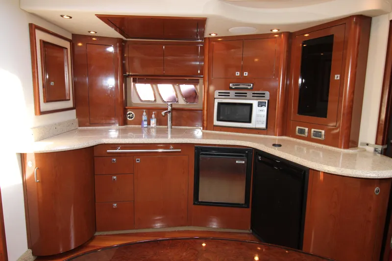 Rowdy Rio Yacht Photos Pics Luxurious kitchen interior of 2008 Sea Ray 44 Sundancer yacht with modern appliances.