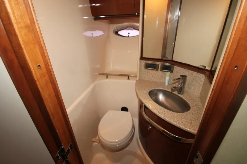 Rowdy Rio Yacht Photos Pics Bathroom interior of 2008 Sea Ray 44 Sundancer yacht with sink and toilet.