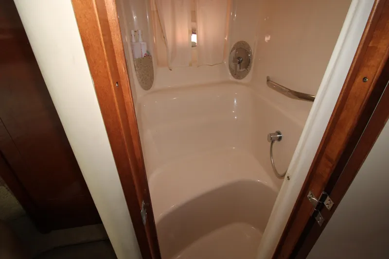 Rowdy Rio Yacht Photos Pics Bathroom interior of 2008 Sea Ray 44 Sundancer yacht, featuring a compact shower area.