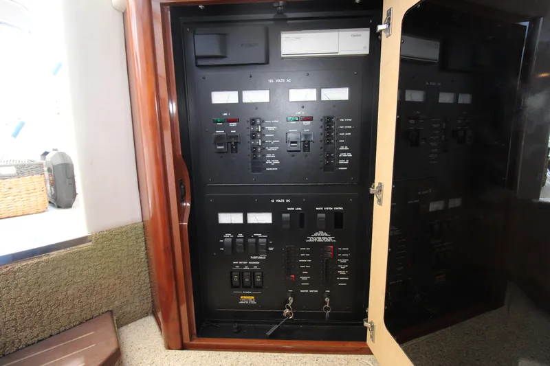 Rowdy Rio Yacht Photos Pics Electrical panel inside 2008 Sea Ray 44 Sundancer yacht, showcasing control switches and circuit breakers.
