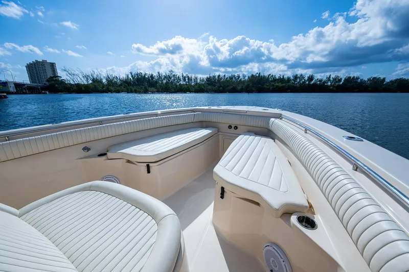  Yacht Photos Pics 2012 Grady-White 336 boat interior with white seating, on a sunny day by the water.