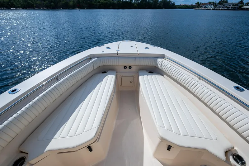  Yacht Photos Pics 2012 Grady-White 336 boat interior with spacious seating on calm water.