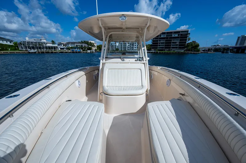  Yacht Photos Pics 2012 Grady-White 336 boat with white seating, docked on a sunny day.