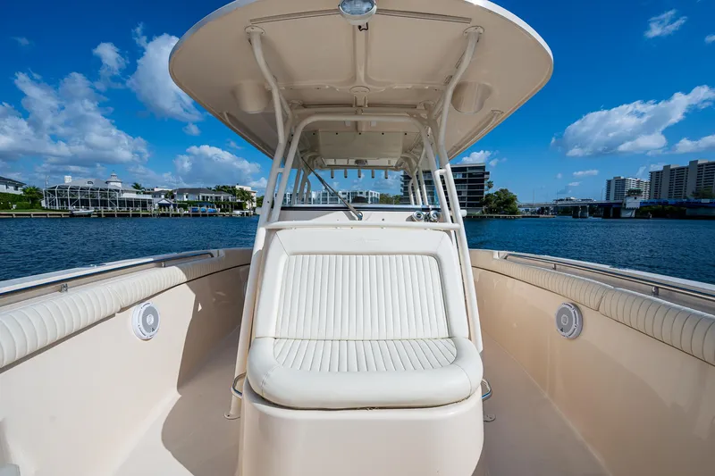  Yacht Photos Pics 2012 Grady-White 336 boat on water, featuring spacious seating and clear blue skies.
