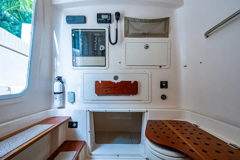  Yacht Photos Pics 2012 Grady-White 336 cabin interior with storage, seating, and communication equipment.