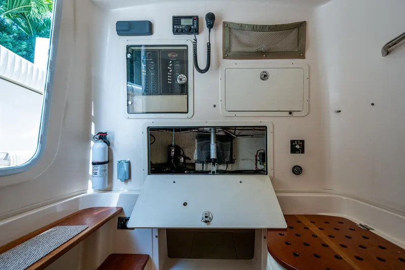  Yacht Photos Pics 2012 Grady-White 336 boat interior with control panel and seating.