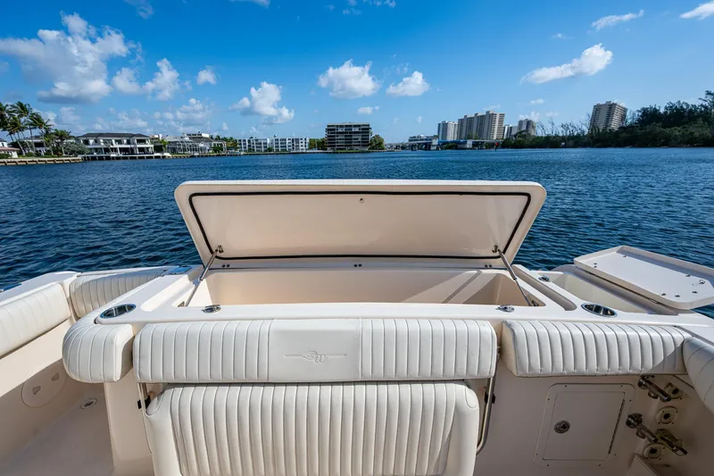 Yacht Photos Pics 2012 Grady-White 336 boat with open storage, scenic waterfront view.