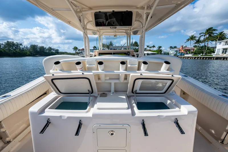  Yacht Photos Pics 2012 Grady-White 336 boat interior with open storage compartments, rod holders, and scenic water view.