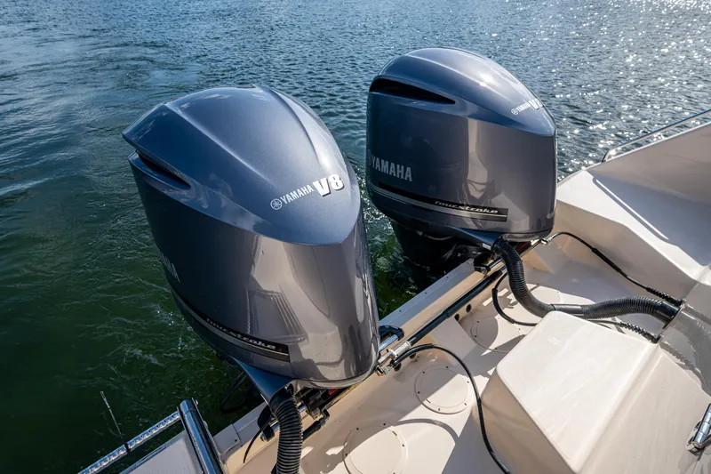  Yacht Photos Pics Twin Yamaha V8 outboard engines on a 2012 Grady-White 336 boat, docked on water.