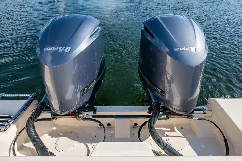  Yacht Photos Pics Twin Yamaha V8 engines on a 2012 Grady-White 336 boat, floating on water.