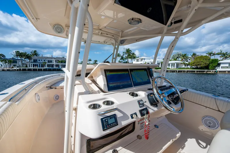  Yacht Photos Pics 2012 Grady-White 336 boat cockpit with modern controls and waterfront view.