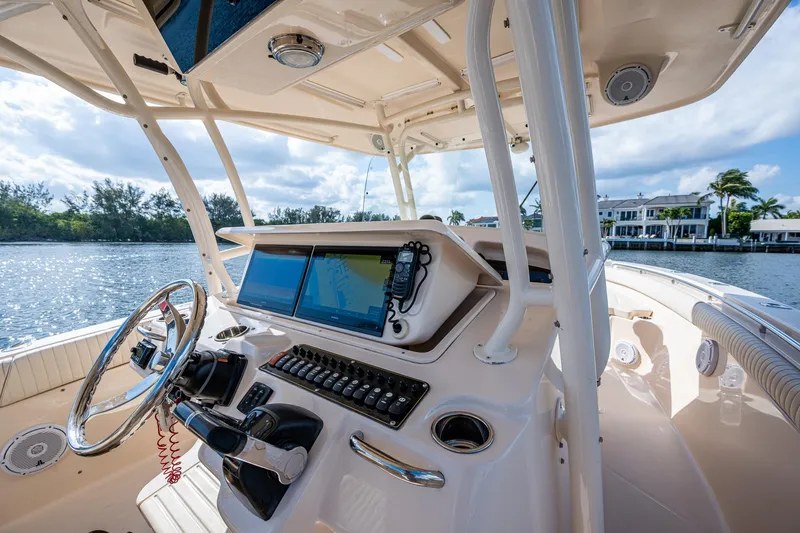  Yacht Photos Pics 2012 Grady-White 336 boat helm with modern controls and scenic waterfront view.