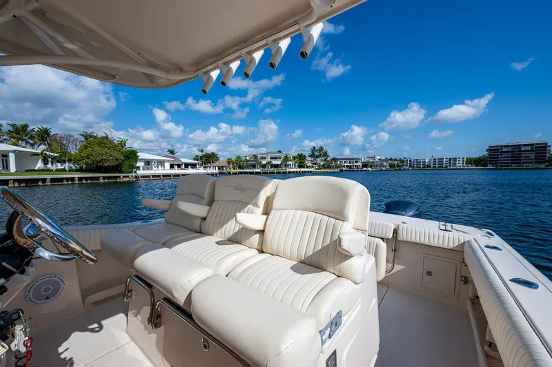  Yacht Photos Pics 2012 Grady-White 336 boat interior with luxurious seating, overlooking a scenic waterfront.
