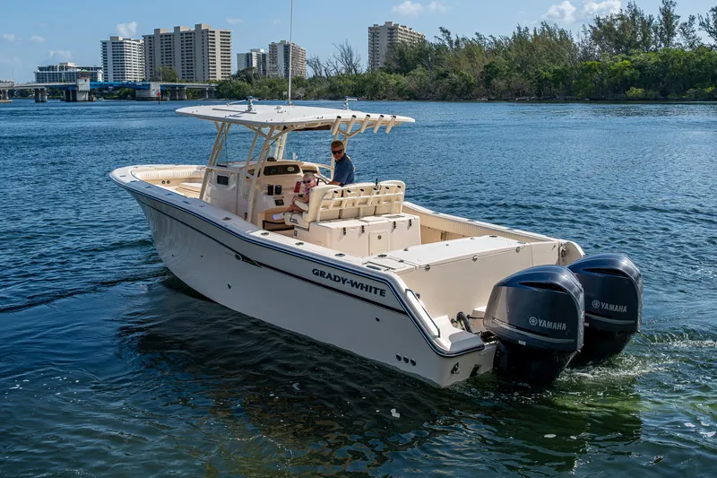  Yacht Photos Pics 2012 Grady-White 336 boat with twin Yamaha engines on a sunny waterway.