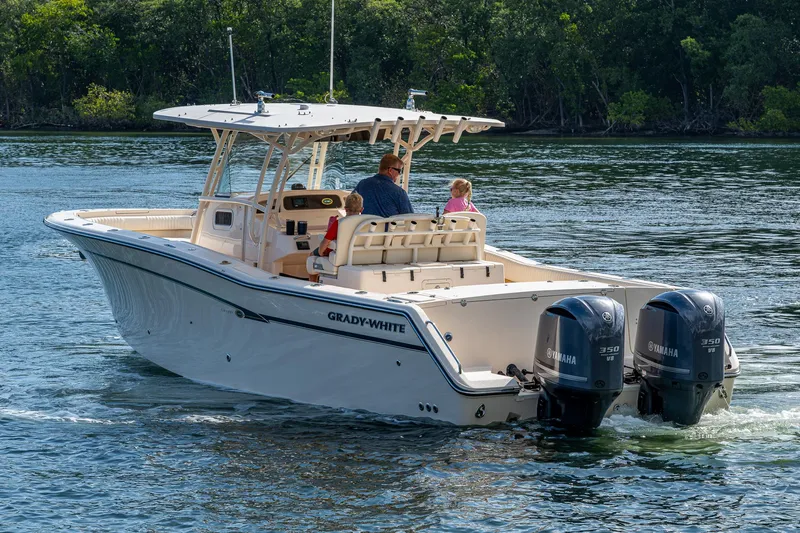  Yacht Photos Pics 2012 Grady-White 336 boat cruising on water with dual Yamaha engines.