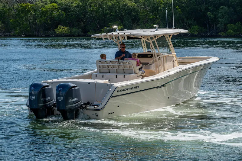  Yacht Photos Pics 2012 Grady-White 336 boat cruising on a calm lake with two outboard motors.