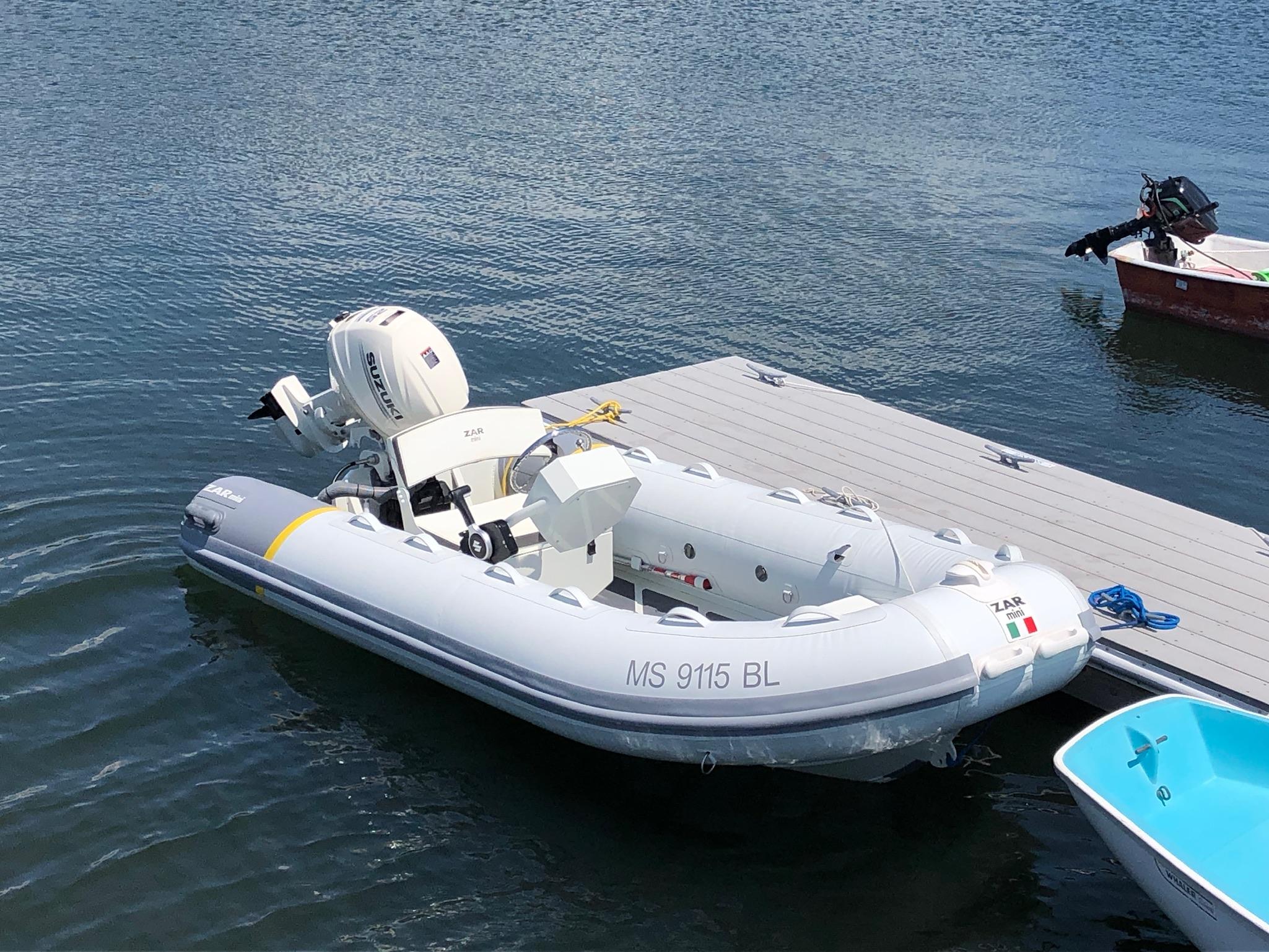 2022 ZAR Mini 13 HDL inflatable boat docked on water.