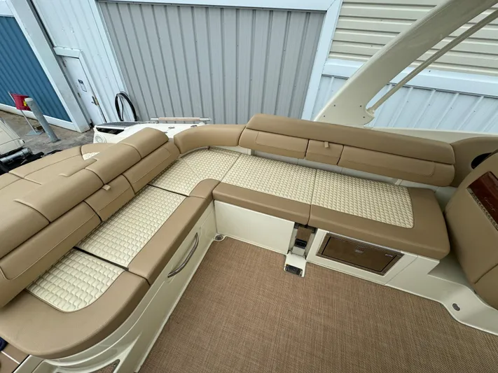  Yacht Photos Pics 2021 Chris-Craft Launch 31 GT boat interior with beige cushioned seating.