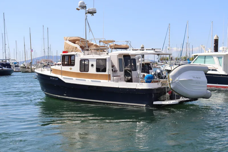 Yellow Jacket Yacht Photos Pics 2020 Ranger Tugs R-31 CB boat docked in marina, featuring sleek design and modern amenities.