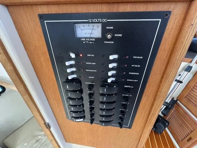 Yellow Jacket Yacht Photos Pics Electrical panel of 2020 Ranger Tugs R-31 CB boat, featuring switches and voltage meter.
