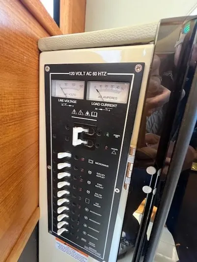 Yellow Jacket Yacht Photos Pics Electrical panel on 2020 Ranger Tugs R-31 CB boat, showing voltage and current meters.