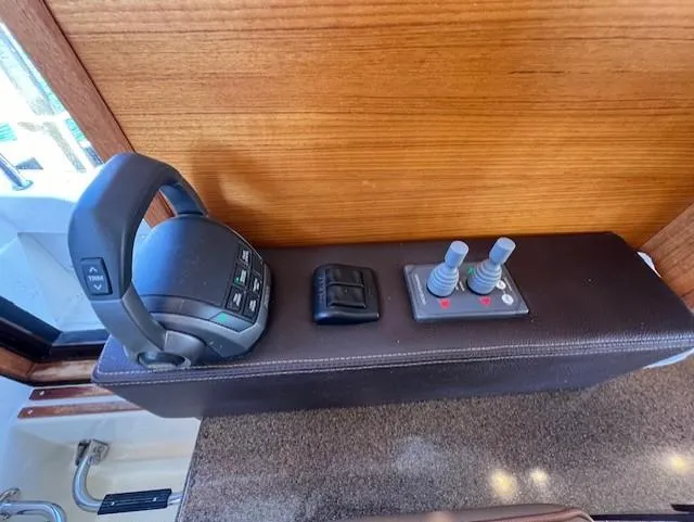 Yellow Jacket Yacht Photos Pics Control panel of 2020 Ranger Tugs R-31 CB with throttle and joystick controls.