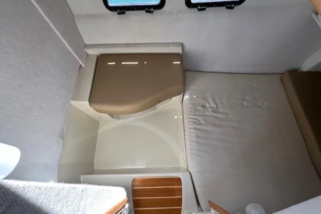 Yellow Jacket Yacht Photos Pics 2020 Ranger Tugs R-31 CB interior cabin with compact bed and seating area.