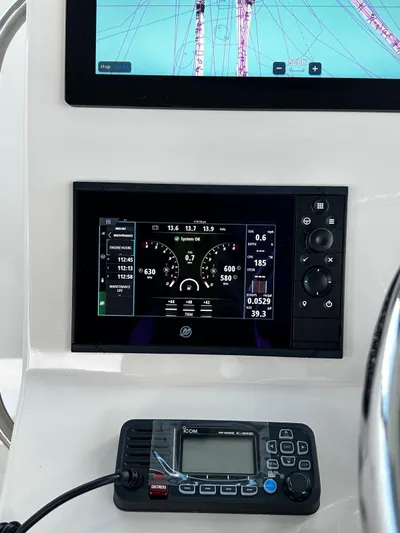  Yacht Photos Pics 2022 Boston Whaler 345 Conquest dashboard with navigation and communication equipment.